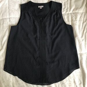 Black sleeveless top with small white polka dots
